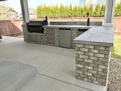 CONCRETE-PATIO-WITH-TAP-